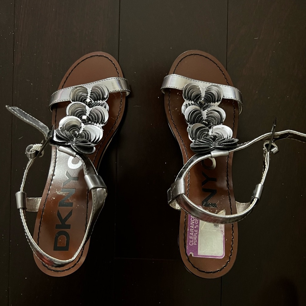 DKNY silver floral patent leather sandal with wood wedge.